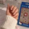 The Crème Shop x Hello Kitty 50 Calcomanías Uñas + Clear Polish Calcium & Protein